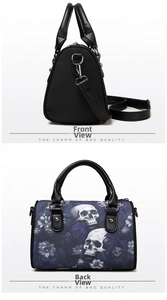 Close-up of black pillow bag with white skull and purple floral print on the back view