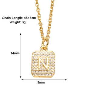 Detailed view of gold square letter N pendant necklace with dimensions 14mm by 9mm