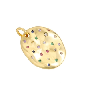 Detailed view of a gold oval metal pendant with textured surface and colorful gemstones