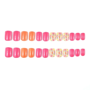 Short square glossy press-on nails with pink orange colors and small floral design
