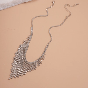 Detailed view of luxury silver tassel necklace with rhinestones and lobster clasp