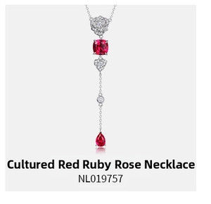 Macro detail of S925 silver necklace with lab-grown ruby and rose flower element