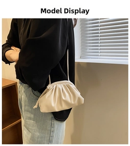 Chic cream-white soft PU leather dumpling bag with drawstring strap on shoulder model