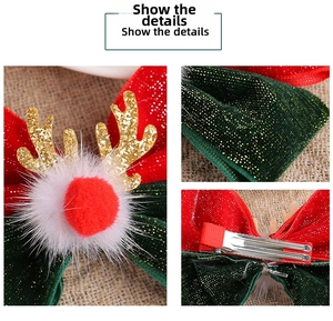 Detail of Christmas reindeer antler hair clip with velvet bow and fluffy pompom
