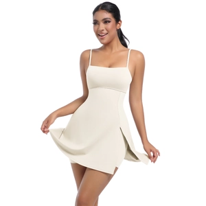 Detail of cream-colored tennis dress featuring slim straps and a side slit design