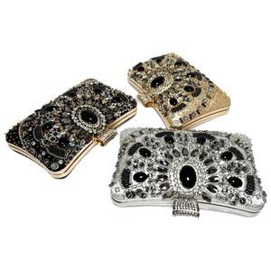 Luxury beaded evening clutch bags in black, gold, and silver with rhinestone accents
