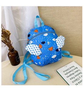 Blue toddler safety backpack featuring cartoon bear print and white polka dot wing details