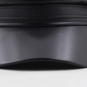 Minimalist black leather baker boy hat with premium double stitching and vintage texture