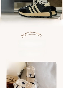 Detail of double needle cotton socks featuring a black rabbit embroidery and stripes