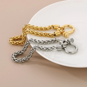 Close-up of gold and silver stainless steel keel chains with horseshoe screw clasps