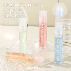 Sparkling pearly roller lip gloss in colorful transparent tubes with hydrating liquid