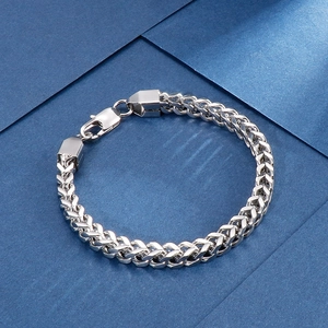 Detailed view of silver stainless steel dragon bone chain bracelet with lobster clasp