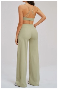 Detail of cross back yoga bra and high waisted wide leg sports pants in olive green