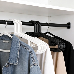 Space-saving black and white non-slip plastic clothes hangers for home and wardrobe use