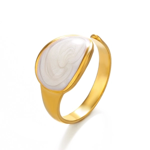 Adjustable gold plated ring featuring white pearlescent enamel in a minimalist oval design