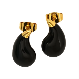 Minimalist gold teardrop stud earrings with elegant black enamel inlay on white backdrop