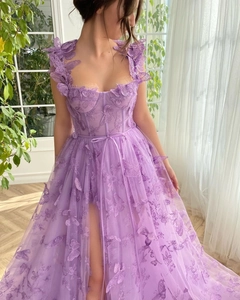 Detail of lavender tulle dress with 3D butterfly appliques and corset style bodice