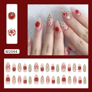 Press on nails with 3D strawberry designs, red dots, and silver stars in a glossy finish