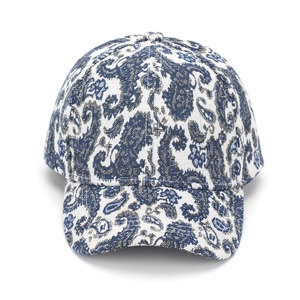 Close-up of blue and white paisley pattern on high-quality jacquard baseball cap fabric