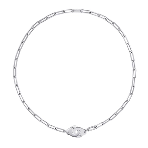 Detail view of the silver paperclip chain link and handcuff-shaped clasp design