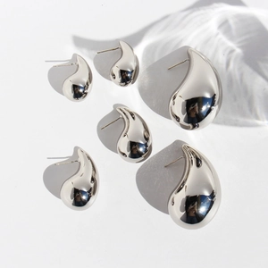 Polished silver teardrop earrings set in three sizes with reflective mirror finish