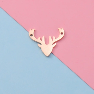 Detailed view of rose gold antler connector with dual holes for DIY jewelry making