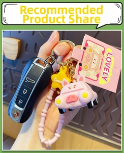 Pink cartoon pig keychain set with silicone beaded wristlet and gold metal clasp charm