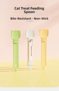 Three colorful cat treat squeezing spoons in green, white and yellow pastel tones