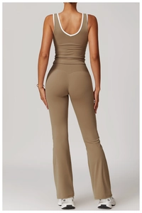 Detail of high-waisted flared leggings with V-shaped back seam and racerback yoga tank top