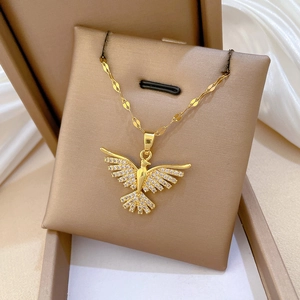 Golden phoenix pendant necklace with white zircons on textured flat chain