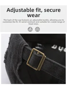 Detail of adjustable vintage black baseball cap with bronze metal buckle closure