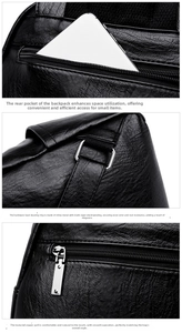 Detail of black pebbled leather backpack with silver metal rings and back zipper pocket
