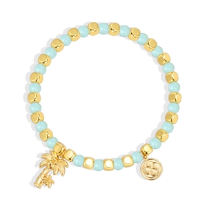 Bohemian gold-plated coconut tree beaded bracelet with light blue beads on white background