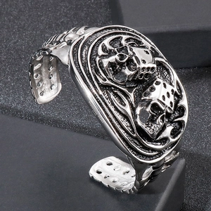 Gothic punk stainless steel open cuff bracelet with skull and dice relief carvings