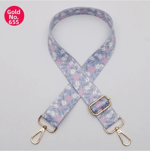 Detail view of adjustable wide shoulder strap No.655 with blue floral pattern and gold hooks