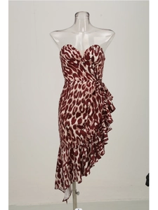 Detail of red and white leopard print dress with asymmetric ruffled hemline and tube top