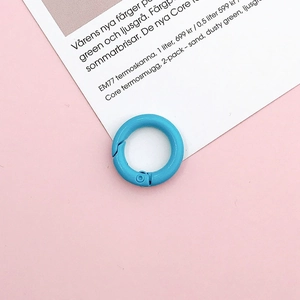 Close-up of 20mm sky blue painted metal spring ring buckle for DIY jewelry and bags