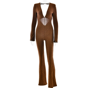 Detail of shimmering brown jumpsuit featuring deep V-neck and abdominal cutout design