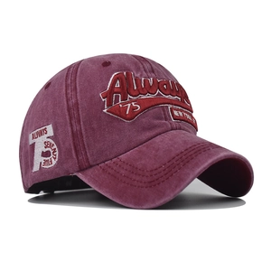 Detail of 3D embroidery and Always 75 text on washed burgundy cotton baseball cap