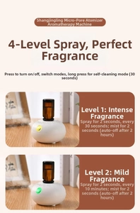 Macro detail of essential oil diffuser showing four-speed misting settings and glass bottle