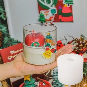 DIY Christmas candle silicone mold showing the mold base and finished festive glass candle