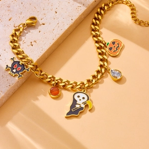Detailed view of Halloween bracelet with skull pumpkin and reaper charms on gold chain