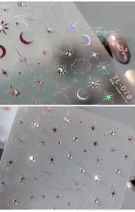 Macro view of holographic 5D star and moon nail stickers with iridescent laser finish