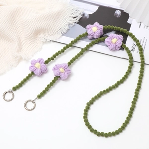 Winter plush beaded crossbody phone lanyard with purple crochet flowers and green beads