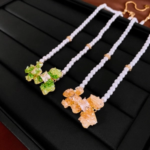 Elegant gold plated pearl necklace with green and amber crystal flower stone pendants