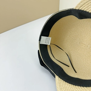 Close-up of internal sweatband and 100% paper material label on summer straw hat
