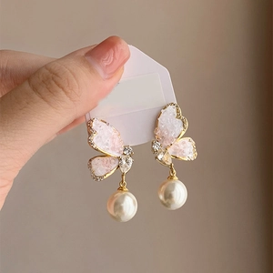 Elegant butterfly drop earrings with gradient crystal wings and large round white pearls