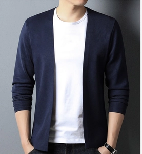 Close-up of the premium navy knit texture and collar detail on this men's cardigan