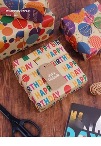 Close-up of Happy Birthday kraft wrapping paper with colorful letters and hemp rope
