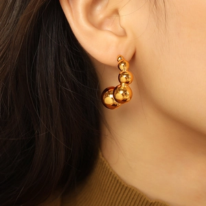 Polished gold bean-shaped drop earrings for women with multi-bead minimalist design